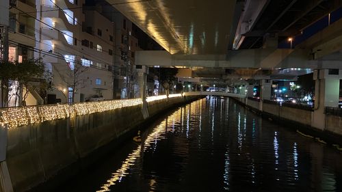 Reflection of illuminated buildings in canal at night