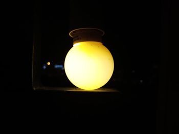 Close-up of illuminated light bulb