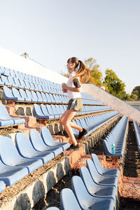 Active lifestyle. teenager girl working out at the staduim running up the stairs