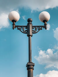 Low angle view of street light against sky