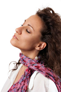 Close-up portrait of a beautiful young woman over white background