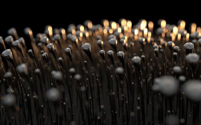 Close-up of candles against black background