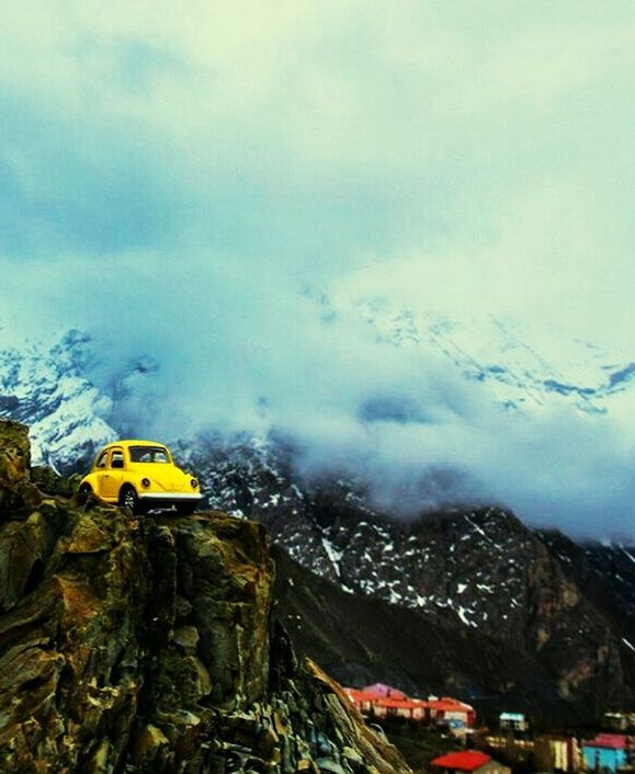 sky, cloud - sky, mountain, architecture, no people, yellow, built structure, outdoors, building exterior, city, nature, tree, beauty in nature, cityscape, day