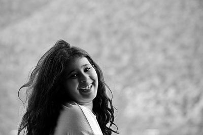 Close-up of young woman looking away