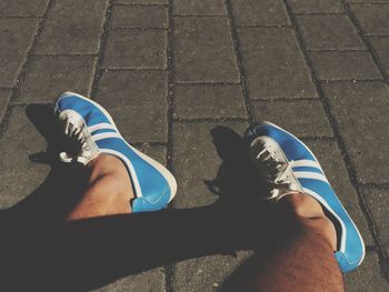 Young woman standing on tiled floor