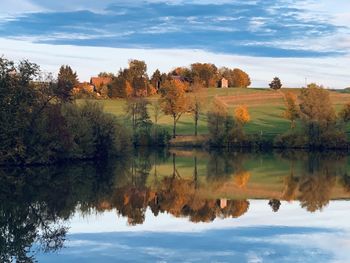 Scenic view of lake against sky during autumn