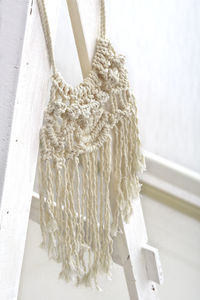 Macrame wall hanging handmade, boho house decoration, cotton yarn textured interior design item. 