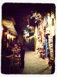 View of illuminated city street at night