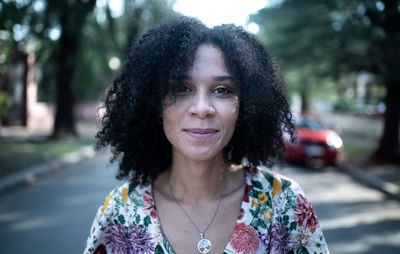 Portrait of smiling young woman outdoors