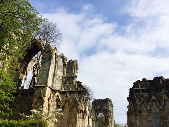 Low angle view of old ruin buildings against sky