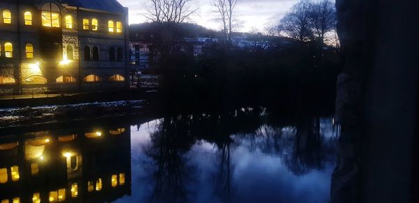 Reflection of illuminated buildings in water at night