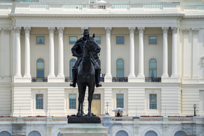 Statue in front of building