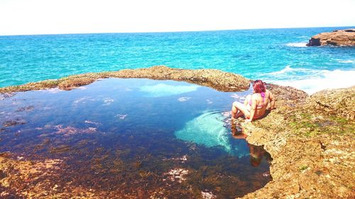 Scenic view of sea against blue sky