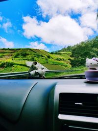 Scenic view of car against sky