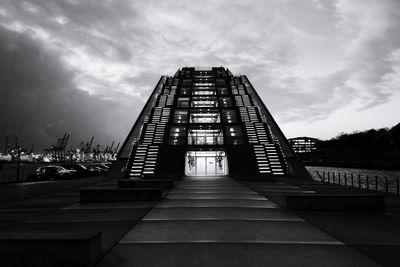 Low angle view of building against cloudy sky