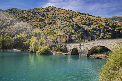 Bridge over river against sky