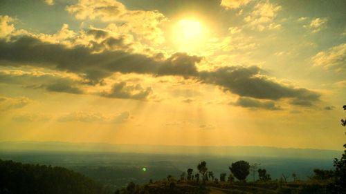 Scenic view of landscape against sky during sunset