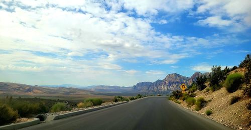 Empty road against sky