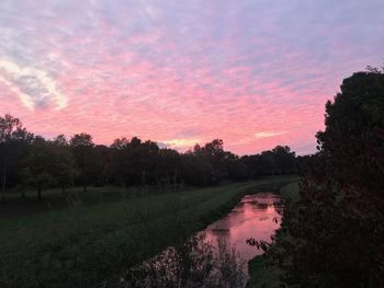 Scenic view of field against sky during sunset
