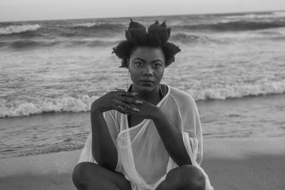 Portrait of woman sitting on beach