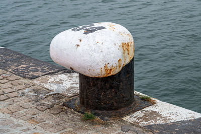 Mooring post at the dock blue sea