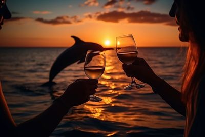 Cropped hand of woman holding wineglass