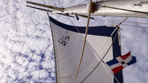 Low angle view of clothes hanging against the sky