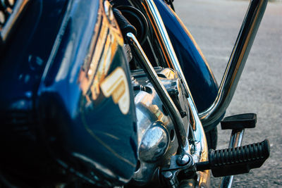 Close-up of motorcycle on road