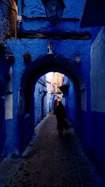 Man looking at archway