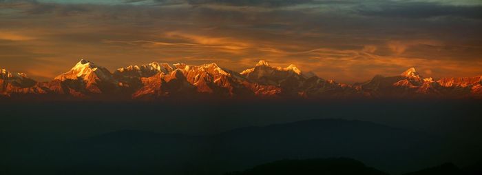 Scenic view of mountains against sky during sunset