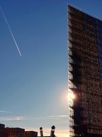 Low angle view of vapor trail against clear sky