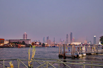 Modern buildings in city against clear sky