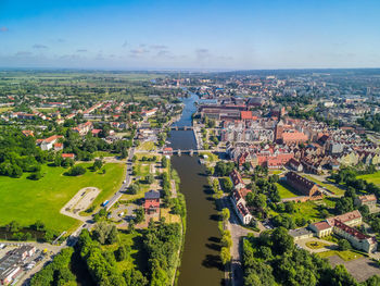High angle view of buildings in city against sky
