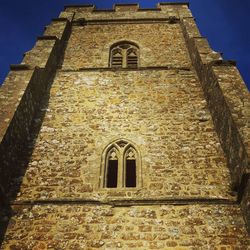 Low angle view of bell tower at night