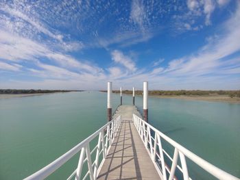 Pier over sea against sky