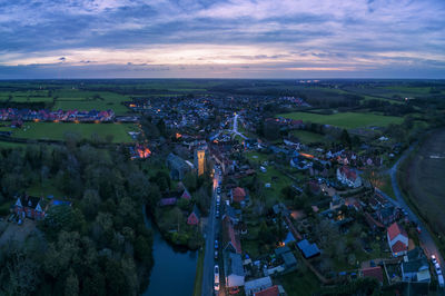 An aerial view at sunrise of the village of haughley in suffolk, uk