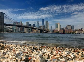 View of sea and buildings against sky