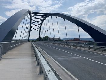 View of bridge against cloudy sky