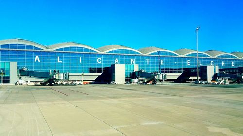 View of built structures against clear blue sky