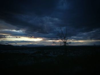 Scenic view of landscape against cloudy sky