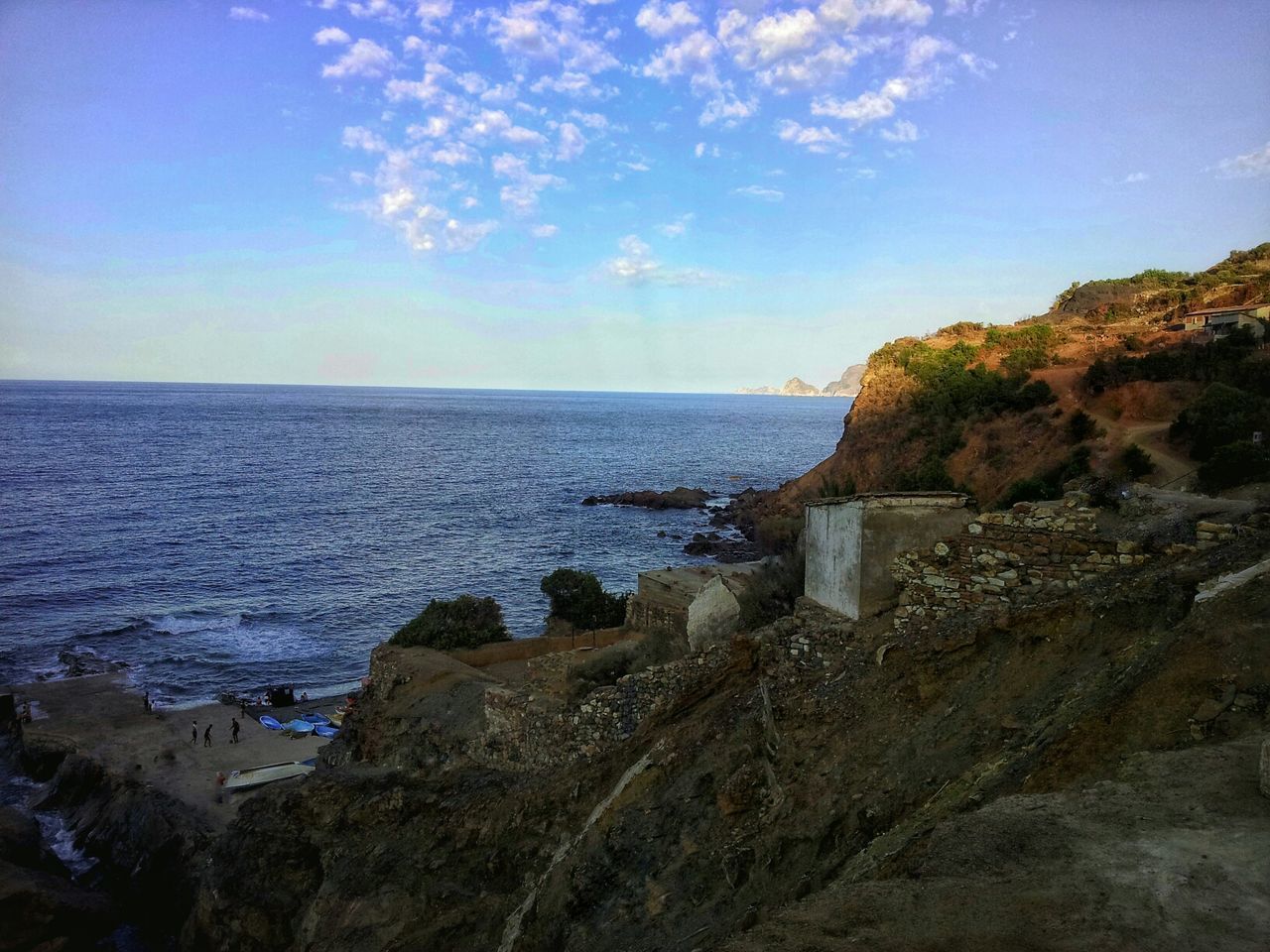 sea, horizon over water, water, sky, scenics, tranquil scene, tranquility, beauty in nature, beach, blue, rock - object, nature, shore, idyllic, rock formation, cloud - sky, coastline, cloud, outdoors, remote