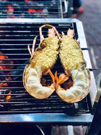 High angle view of meat on barbecue grill