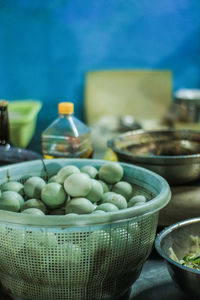 Close-up of eggs in basket on table