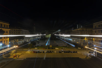 High angle view of light trails on road in city at night