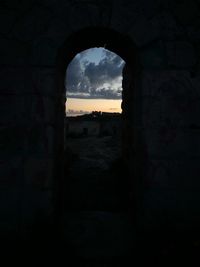 Buildings seen through arch window