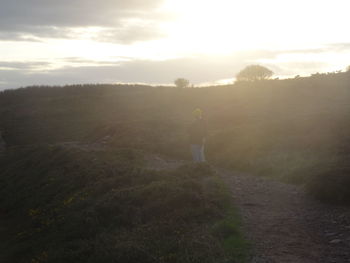 Scenic view of landscape against sky at sunset