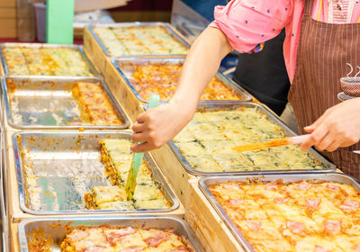 Midsection of man preparing food
