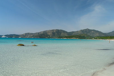 Scenic view of sea against blue sky