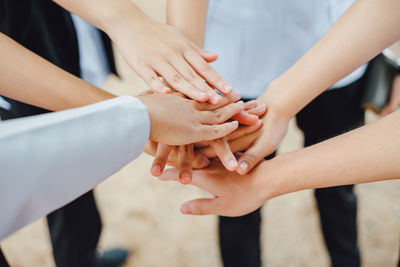 Midsection of woman holding hands