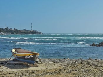 Scenic view of beach against clear sky